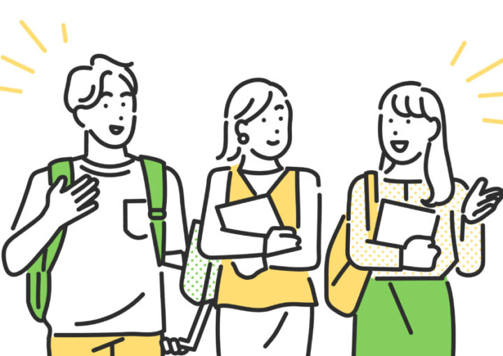 友達同士でお喋りをする男女の大学生のイメー