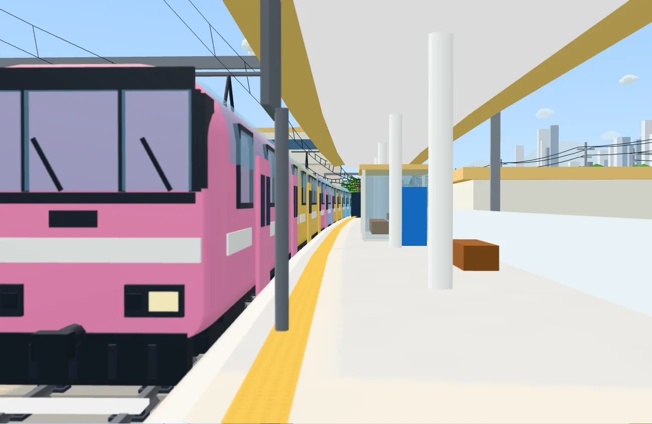 海の近くの、かもめはま駅に入ってくるピンク色の展望電車「きらきら」